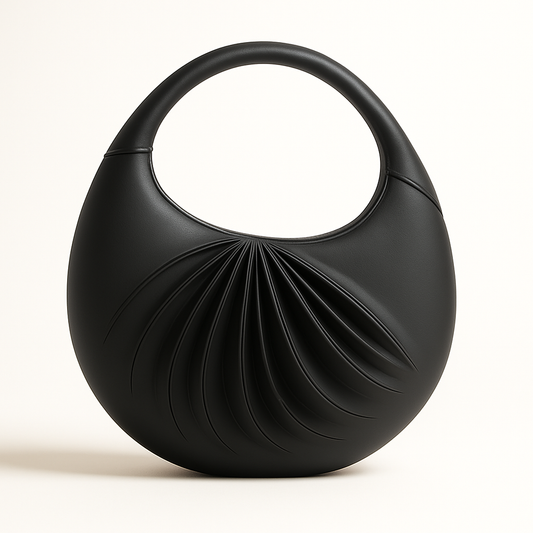 Front view of Sirah, an elegant black leather moon bag, handcrafted in France